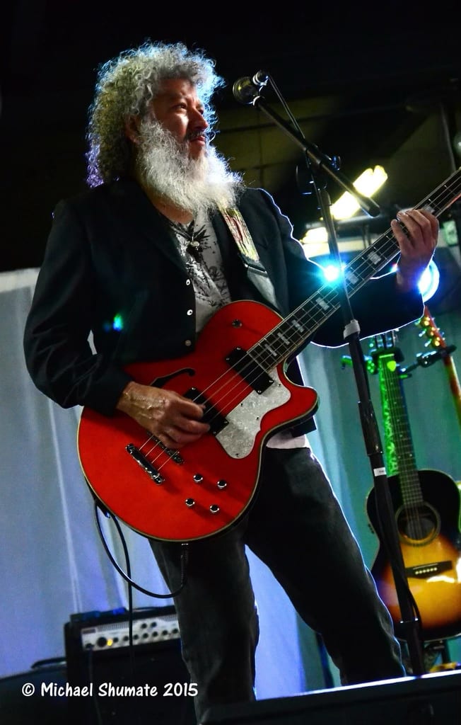 Ron Gomez playing guitar